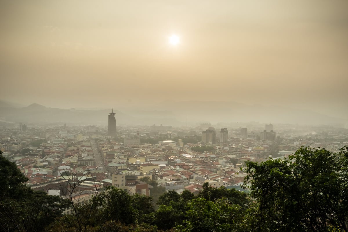 Smoggy sunset in Puli